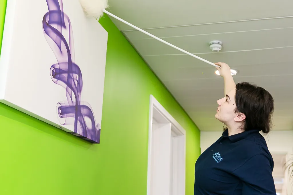 Hashtag Clean staff providing professional 24/7 cleaning services in a commercial office environment