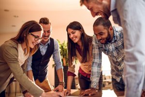 How a Cleaner Office Boosts Staff Wellbeing in Crawley with happy and engaged team